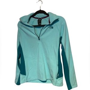 The North Face Teal fleece pullover. 100% polyester.